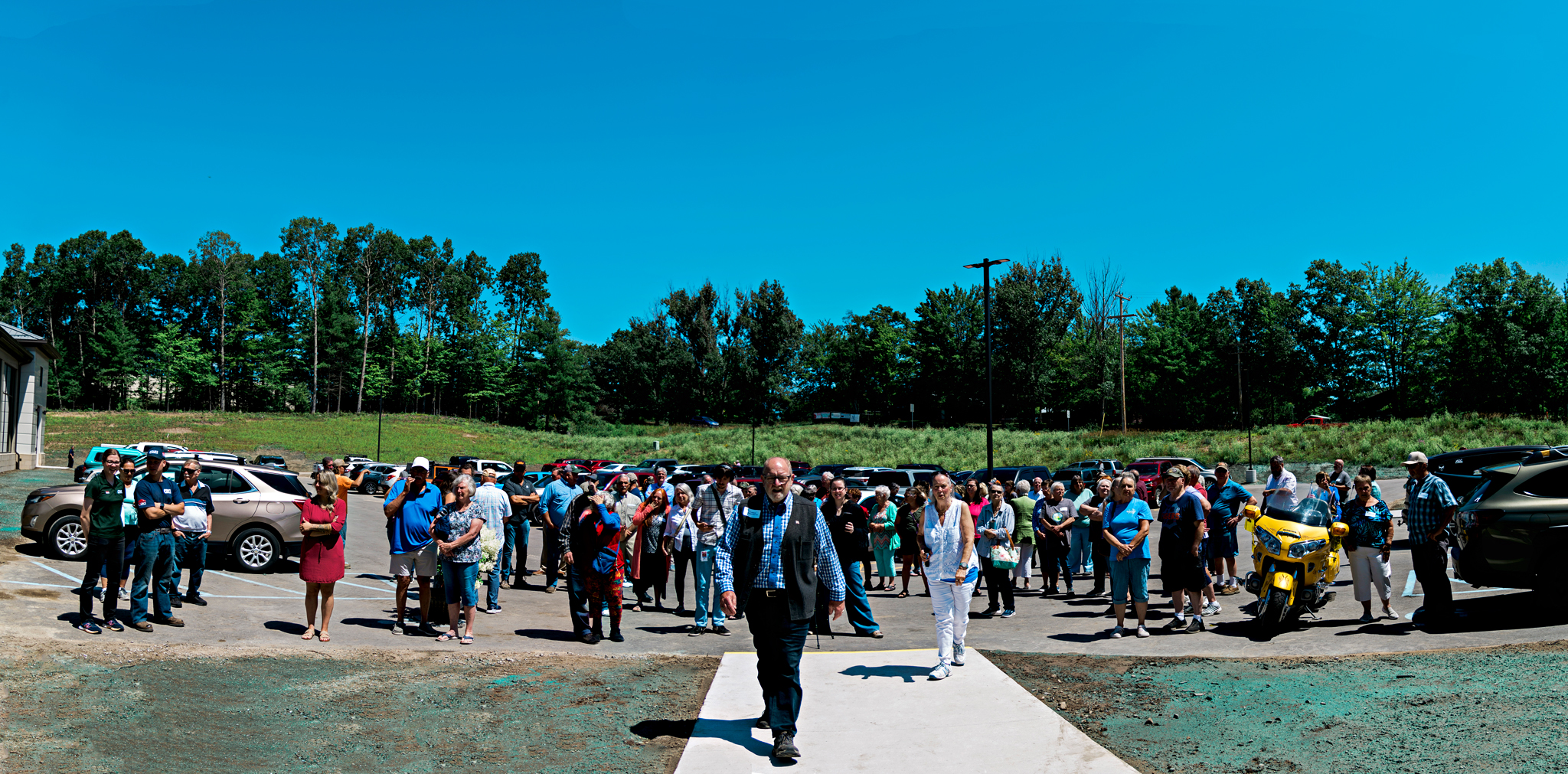 Many people gathered outside the new Sunrise Center to enjoy the grand opening festivities.